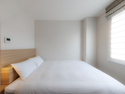 【スタンダードダブル（南館）15㎡】「コーラルグリーン」がアクセントの明るく洗練された空間